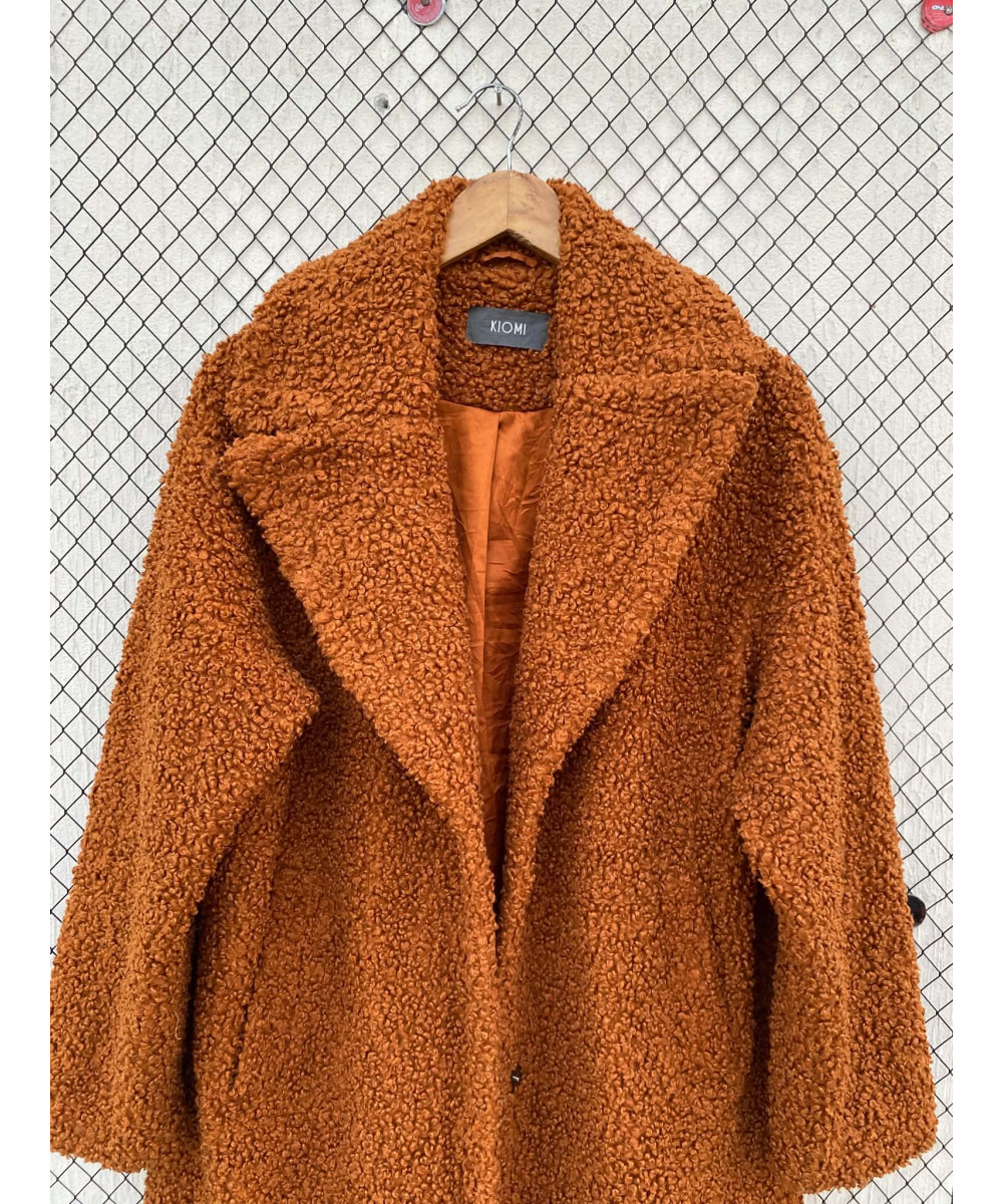 Burnt orange-colored, teddy coat