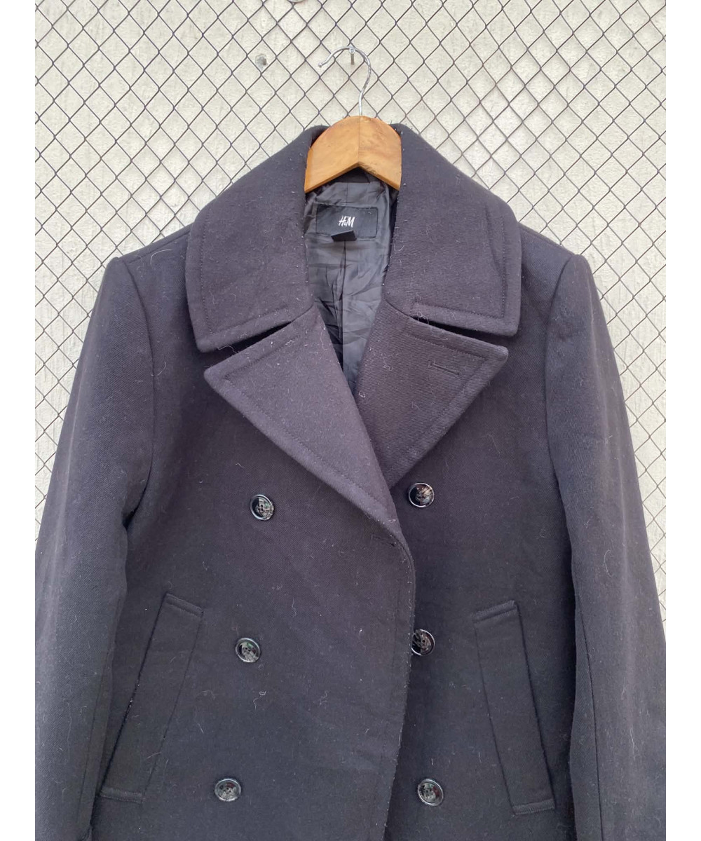 Dull black, double-breasted, wool coat
