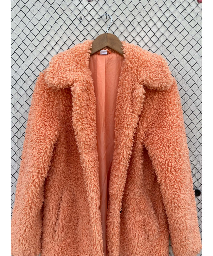 Bright peach-colored, long, faux fur coat
