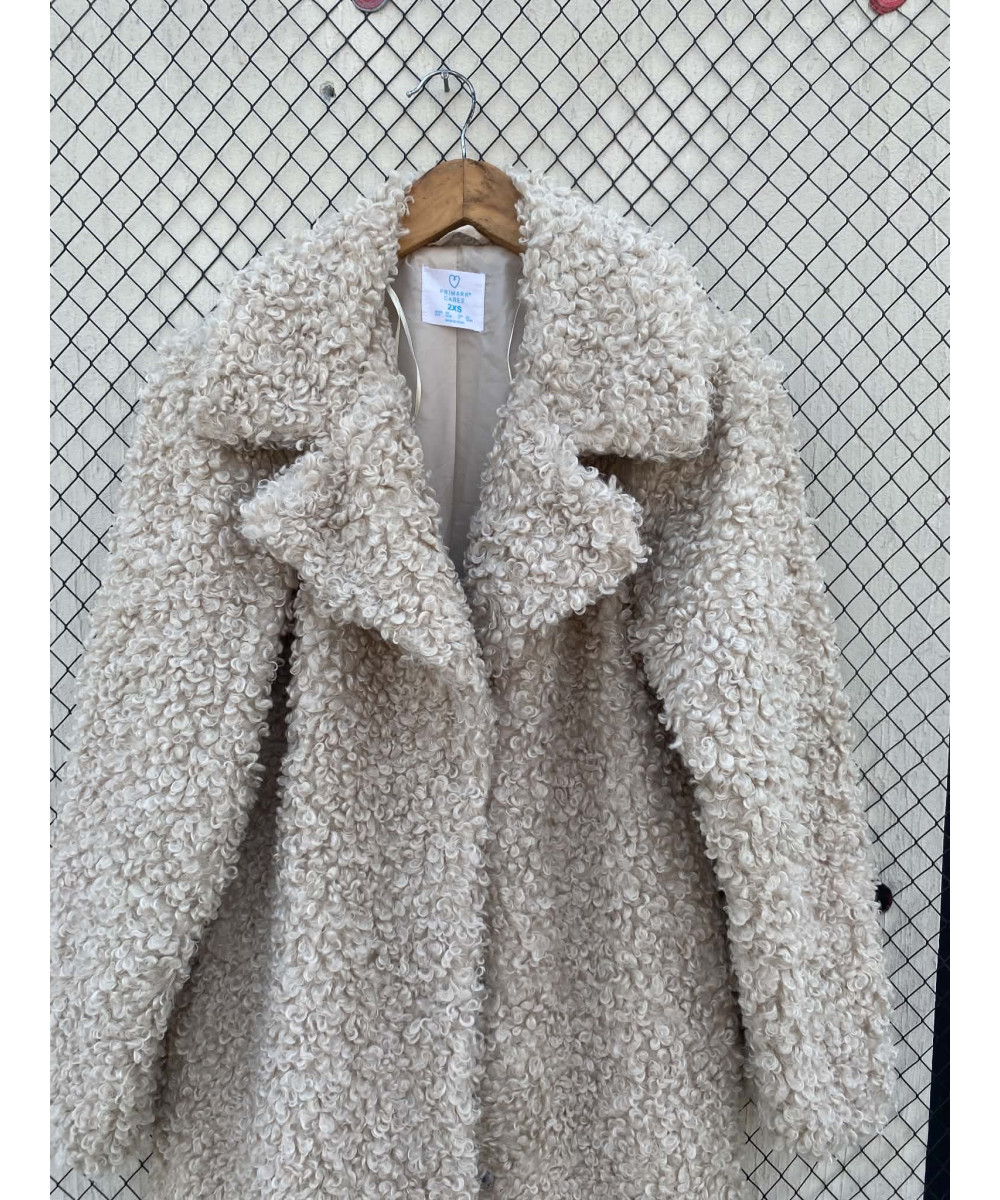 Cream-colored, long, faux fur coat